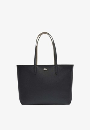 Sac fourre-tout en cuir noir avec deux poignées, texture lisse, design minimaliste et petit logo en argent. Forme structurée, sans motifs.