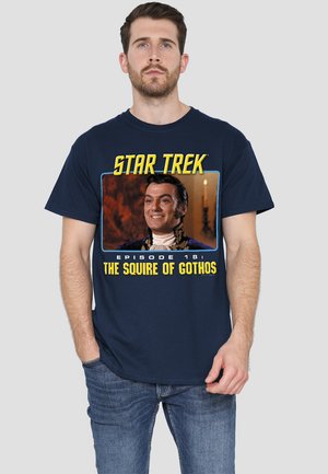 Navy cotton T-shirt featuring "Star Trek" text and a scene from "The Squire of Gothos" episode, along with colorful graphics.