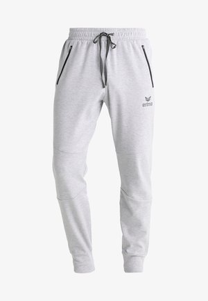 Hellgraue Sweatpants mit elastischem Bund, verstellbarem Kordelzug, seitlichen Reißverschlusstaschen und einem leicht taillierten Schnitt.