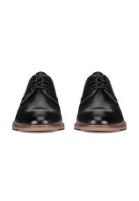Pair of black leather lace-up dress shoes with brown soles, viewed from the front on a white background.
