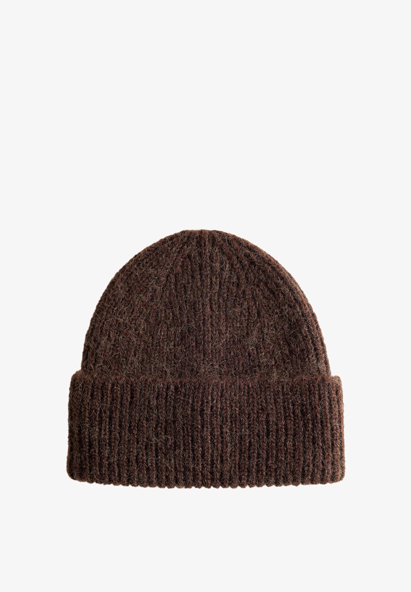Brown knitted beanie hat made of soft, textured wool, featuring a ribbed design and folded brim for added warmth.