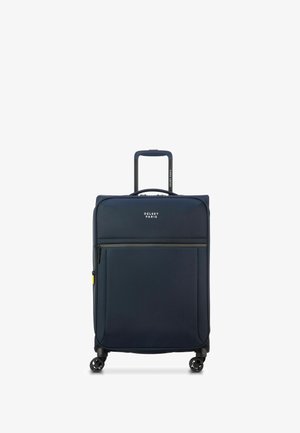 Maleta de polyester azul marino con asa retráctil, cuatro ruedas multidireccionales, bolsillo frontal con cremallera y logotipo de Delsey Paris.