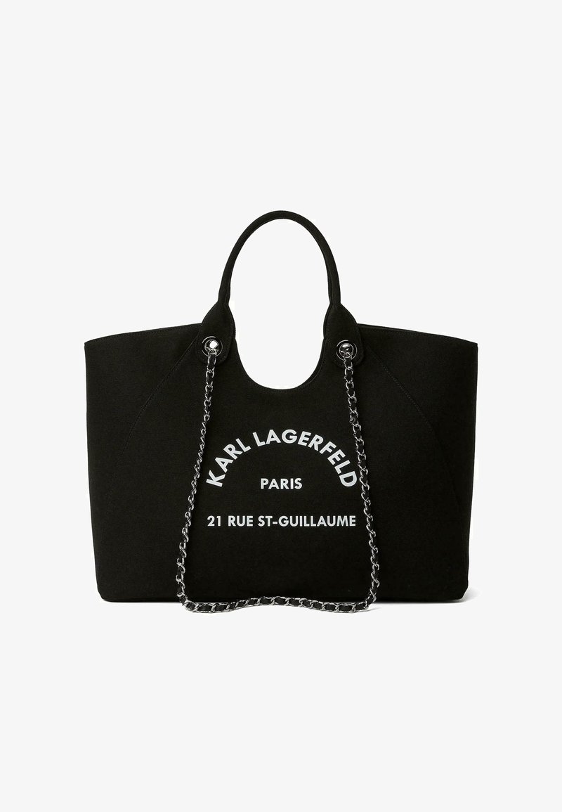Черен шопинг чанта Karl Lagerfeld с верижни дръжки и бял надпис "Karl Lagerfeld Paris 21 Rue St-Guillaume" отпред.
