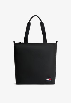 Czarna prostokątna torba typu tote z dwoma paskami na ramię i małą naszywką z logo Tommy Jeans w prawym dolnym rogu.