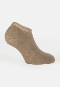 Calcetín de tobillo beige con un tejido suave y texturizado. Presenta un diseño de corte bajo con un puño reforzado y puntera sin costuras.