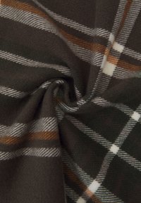 Brown plaid fleece fabric features a pattern of white and orange lines on a dark background, with soft, textured surface.