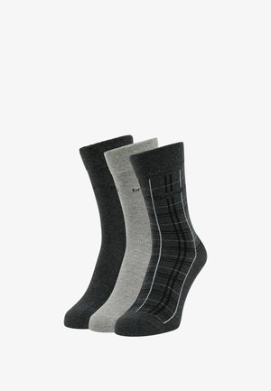 Drei Paar Socken: ein einfarbiges Dunkelgrau, ein einfarbiges Hellgrau und ein schwarzes Paar mit einem schottischen Muster in Grau und Weiß. Genähtes Material, Mittelhohe Länge.