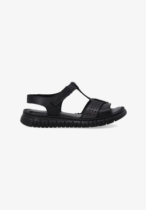 Zwarte sandalen met een T-band ontwerp, geperforeerde accenten, verstelbare enkelband en een gestructureerde rubberen zool voor grip en comfort.