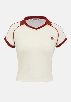 Cream short-sleeve knitted top with red collar, sleeve edges, piping, and small red rose embroidery on the left chest.