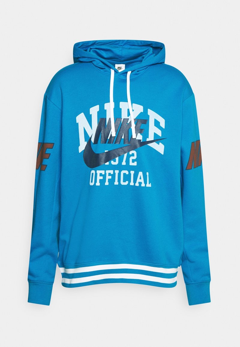 Blå bomullshuvtröja med en framkänguruficka, vita och svarta Nike-logo grafiker, samt randiga vita detaljer vid fållen och ärmslut.