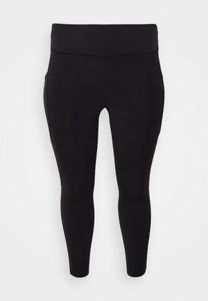 Colanți negri realizați dintr-un material elastic, având un talie înaltă și decupaje la gleznă cu mici accente decorativă pe cusături.