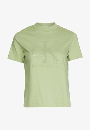 T-shirt vert clair à manches courtes et col rond avec logo "cK Calvin Klein Jeans" en relief sur le devant.