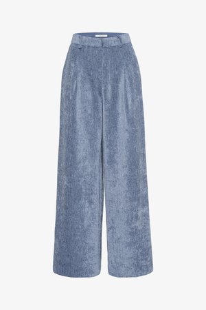 Wide-leg trousers in light blue houndstooth fabric, featuring a flat front, pleats, and a waistband with a zipper closure.
