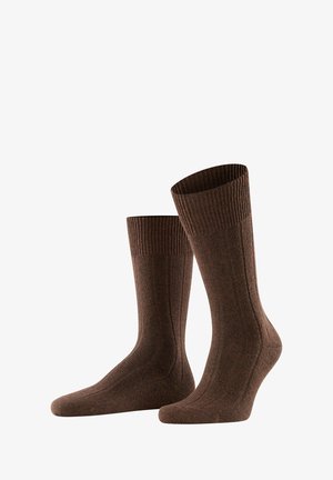Brown ribbed cotton socks with a textured finish, featuring a reinforced heel and toe. The sock cuffs are elasticized for a secure fit.