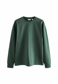 Langärmliges T-Shirt aus tiefgrünem Baumwollstoff, Rundhalsausschnitt, lockere Passform, überschnittene Schultern und gerippte Bündchen mit glatter Textur.