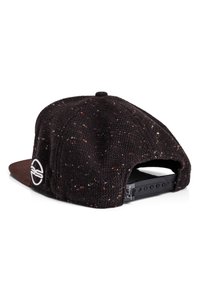 Black knit cap with speckles of color, a flat brown brim, and an adjustable snapback closure featuring a circular logo on the side.