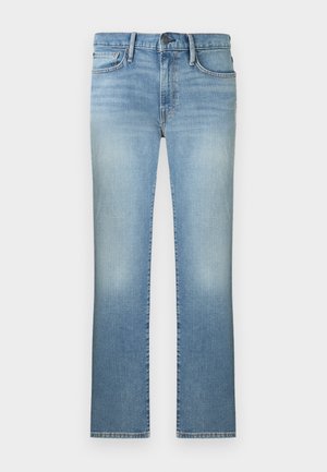 Šviesiai mėlynos tiesios kojos džinsai su išblukusiais detalėmis, užsegami priekyje mygtuku ir užtrauktuku, su diržo kilpelėmis bei priekinėmis ir galinėmis kišenėmis.