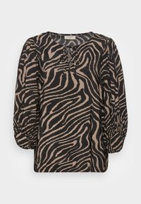 Blusa preta e bege com padrão de zebra. Apresenta um decote redondo, mangas balão franzidas e um detalhe sutil em forma de gota na frente.