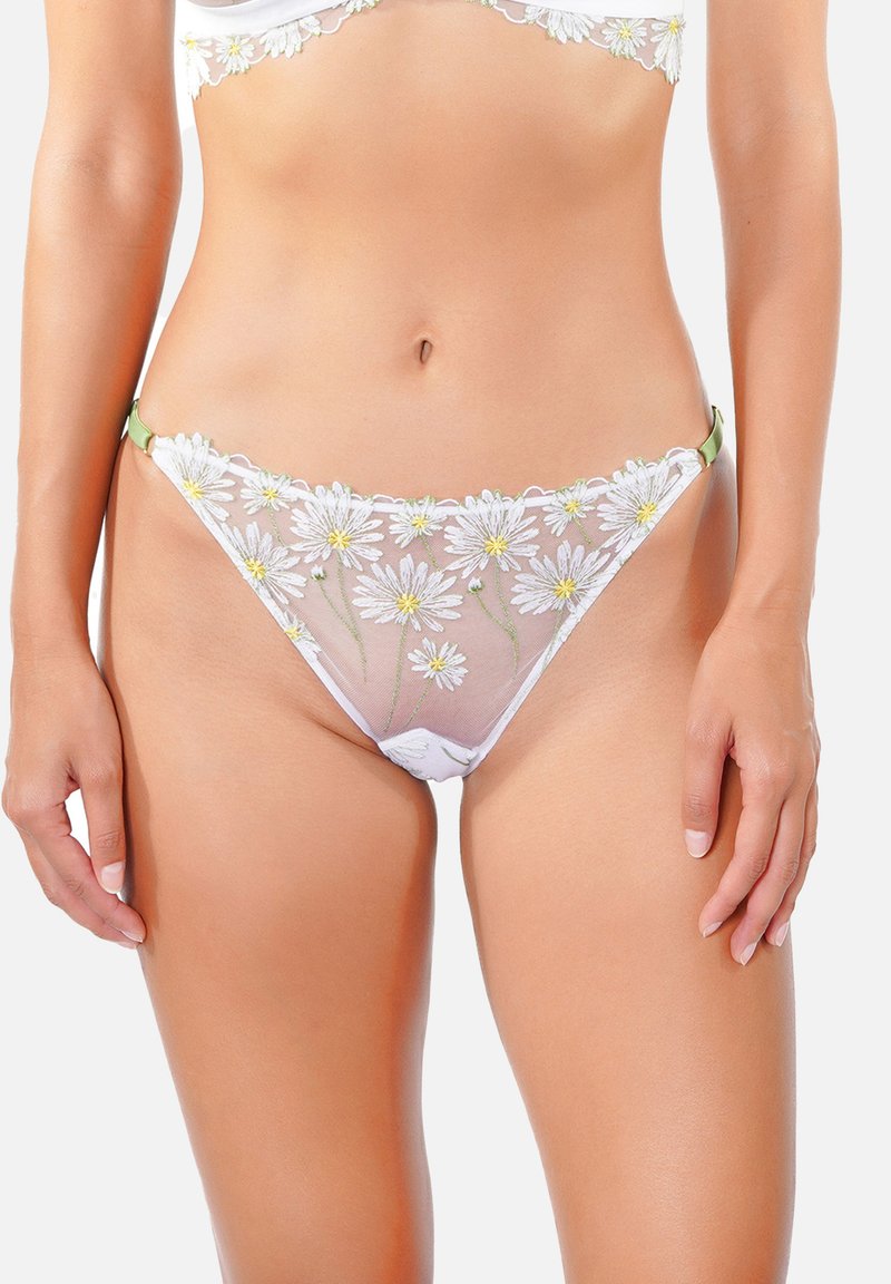 String en dentelle blanche avec broderie florale jaune et verte, en tissu transparent et accents verts sur les côtés.