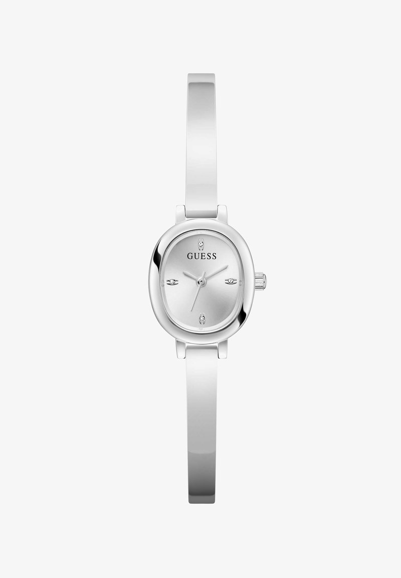 Montre Guess en argent avec un cadran rectangulaire, des marqueurs d'heure minimalistes et un bracelet en métal brillant. Présente une couronne simple sur le côté.