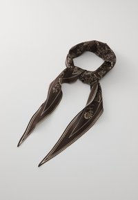 Brown silk scarf featuring a floral pattern in cream, with pointed ends and a smooth texture, tied in a loop.