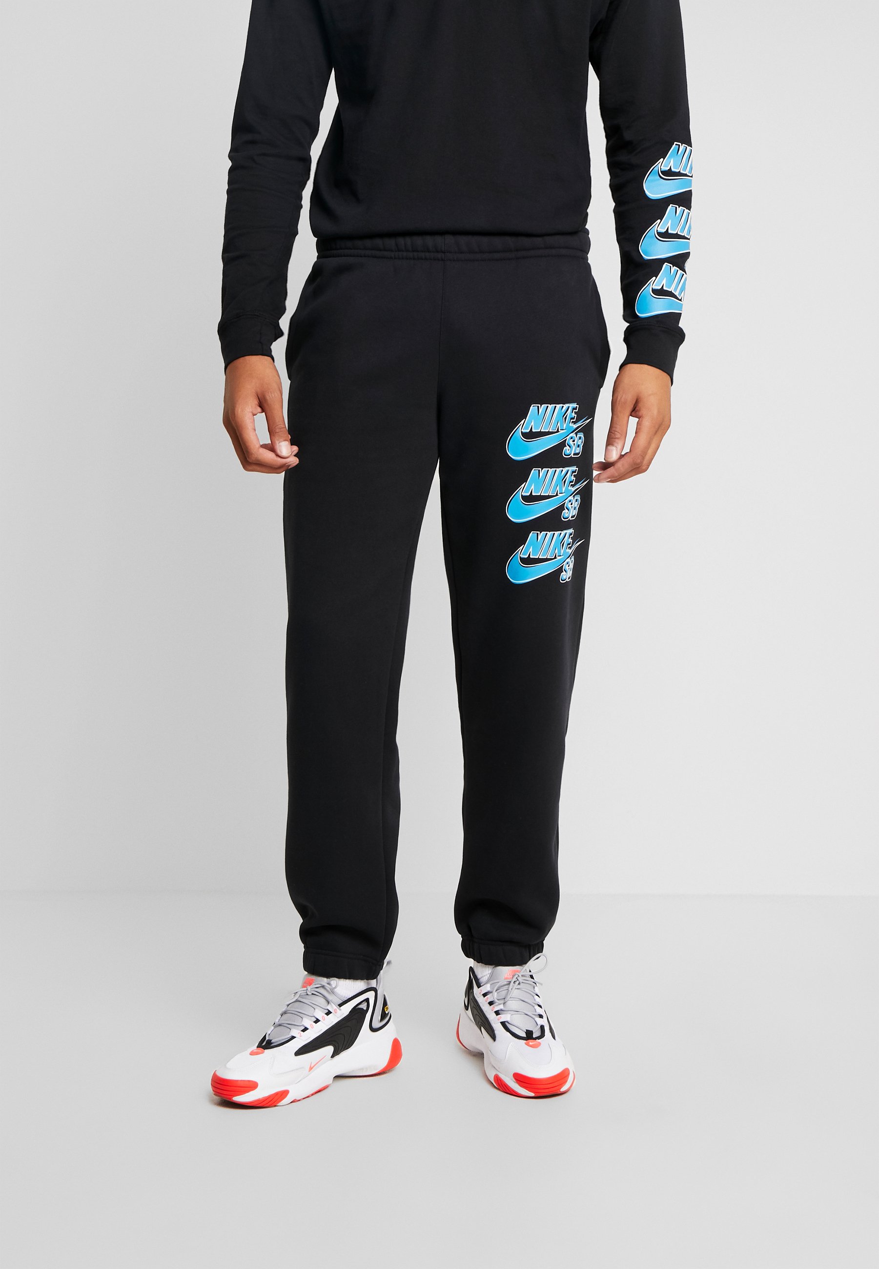 black and blue nike tracksuit