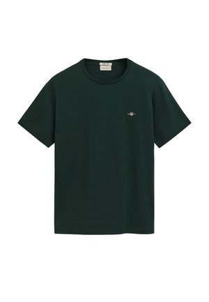 Donkergroene katoenen t-shirt met een ronde hals en korte mouwen. Voorzien van een klein geborduurd logo op de borst. Eenvoudig ontwerp, zonder patronen.