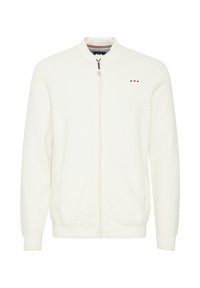 Hvid strik zip-jakke med ståkrave, tekstureret mønster, to sidelommer og lille farvet logo-detalje på brystet.