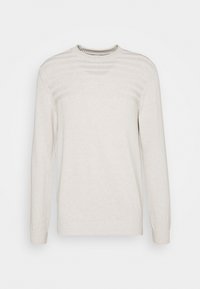 Vaaleanbeige neulepaita, jossa pitkät hihat, pyöreä pääntie, tekstuurilliset raidat rinnassa sekä resorireunukset hihansuissa ja helmassa. Pehmeä neulottu kangas.