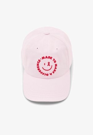 Light pink baseball cap with red embroidered smiley face and text "Made to make a difference" in circular pattern on front panel.