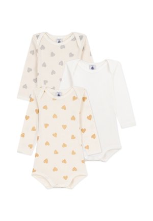 Tre body a maniche lunghe per neonati: uno colore crema con cuori argento, uno colore crema con cuori oro e uno bianco semplice, tutti in cotone morbido.