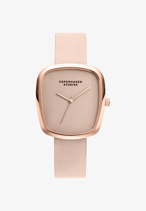 Montre carrée en or rose avec cadran et bracelet beige, design minimaliste, et logo "Copenhagen Studios" sur le cadran.