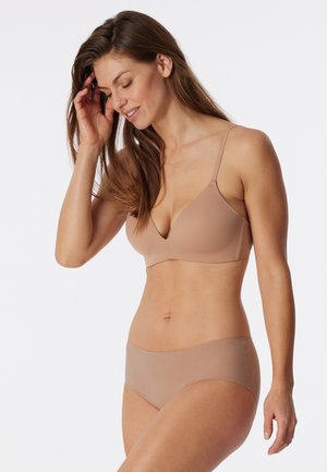 Nude seamless bra with a V-shaped neckline and adjustable straps paired with matching hipster briefs, both made from smooth, stretchy fabric.