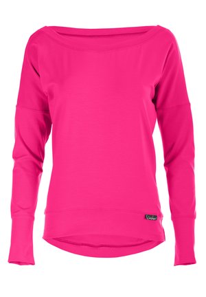 Pink long-sleeve shirt with an off-shoulder neckline, made of smooth fabric, featuring a curved hem and a small branded tag at the bottom.