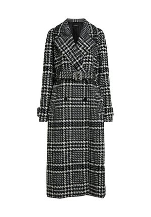 Long manteau noir et blanc à motif pied-de-poule avec larges revers, taille ceinturée, bracelets de manchette et devant croisé à double boutonnage.