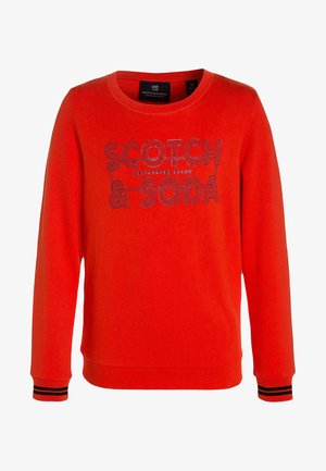 Sweat-shirt rouge à col rond et manches longues. Présente un logo imprimé en bleu, des bandes contrastantes noires et blanches sur les poignets. Texture douce.