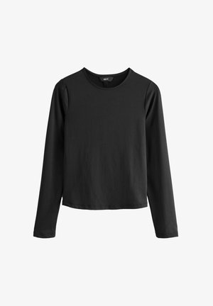 Mustade pika varrukaga särk, mis on valmistatud pehmest kangast, ümarate kaelustega ja vabalt langeva lõikega; omab sirgeid ääriseid, ilma mustrite või kaunistusteta.