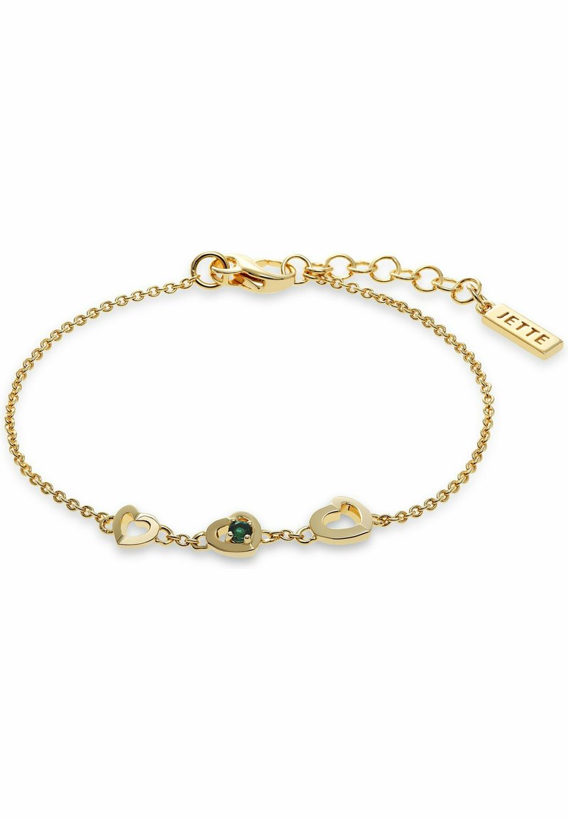 Goldene Kettenarmband mit drei herzförmigen Akzenten, davon einer mit einem grünen Edelstein. Inklusive Karabinerverschluss und verstellbarer Kette.