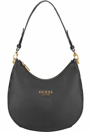 Sac à main GUESS noir en forme de croissant avec fermeture éclair dorée, bandoulière réglable et logo de marque doré "GUESS EST 1981" au centre devant.