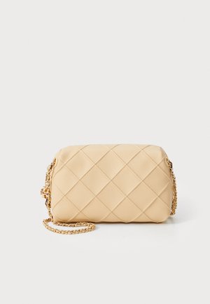 Beige quilted handbag with a rectangular shape, gold chain strap, and smooth texture. Features diamond pattern on the exterior.