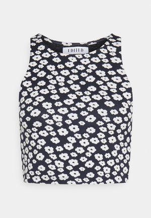 Mouwloos zwart cropped top met hoge hals en witte onregelmatige madeliefjesbloemenpatroon.