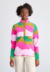 Pullover in felpa con colletto alto, caratterizzato da motivi ondulati in rosa, verde e marrone. Include una patta con bottoni e una tasca sul petto.