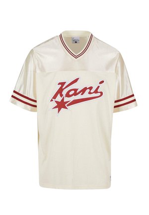 Krémové síťované tričko s červenými akcenty, s výstřihem do V a krátkými rukávy. Červené logo "Kani" s hvězdicovou grafikou na přední straně.