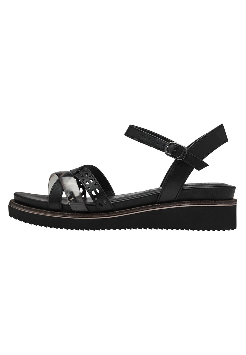 Sandales compensées noires avec des brides en cuir au design découpé, accents transparents, sangle de cheville ajustable et semelle extérieure en caoutchouc texturé.