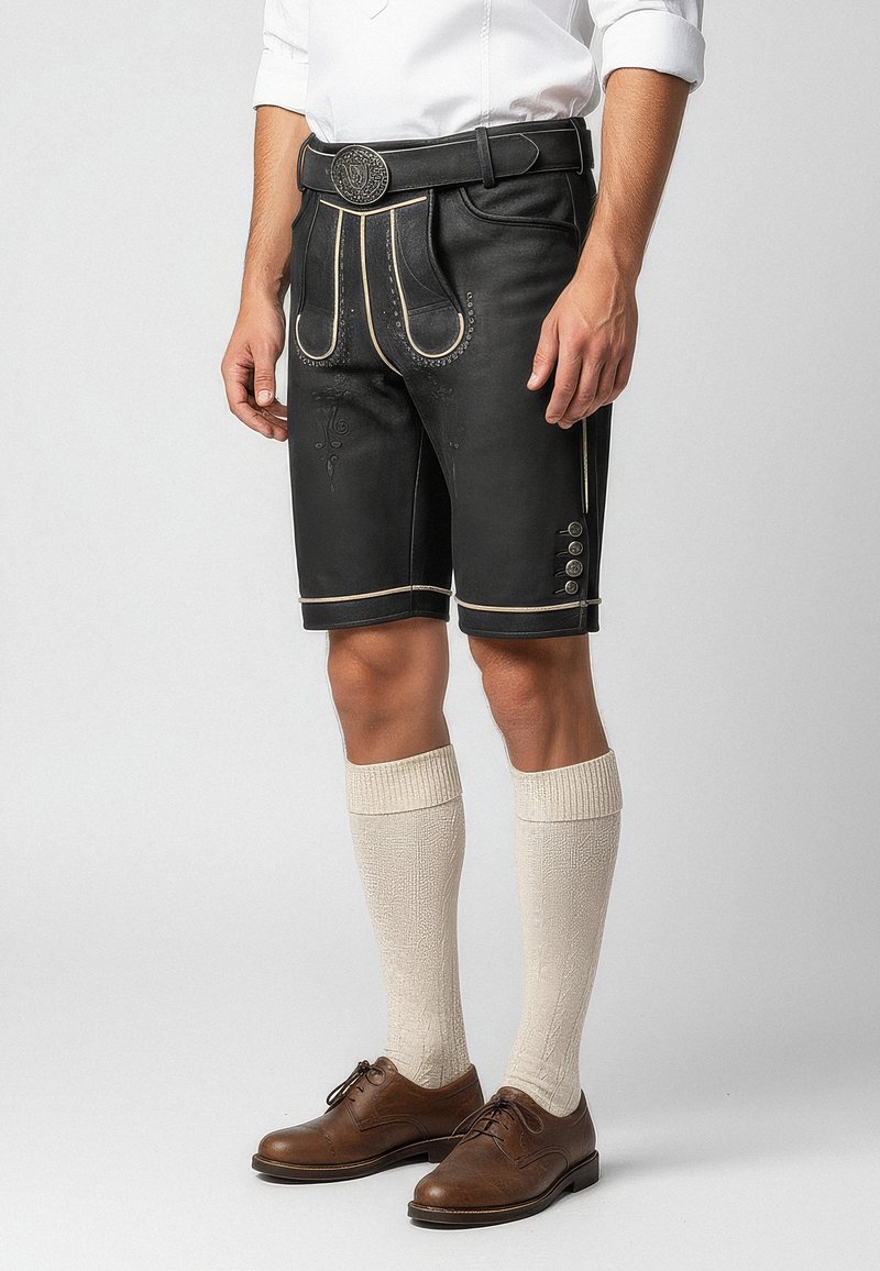 Black leather shorts with white stitching, button accents, and decorative patterns. Paired with knee-high cream socks and brown shoes.