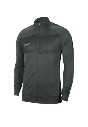 Veste Nike gris foncé zippée sur toute la longueur, panneau en mesh sur la poitrine, manches longues, col haut et logo Nike blanc sur la poitrine gauche.