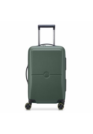 Hard-shell green suitcase with four black and yellow spinner wheels and a telescopic handle extended.