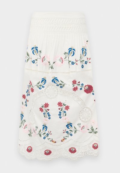 White pleated skirt featuring colorful floral embroidery in blue, pink, and red. Scalloped lace trim adds detailed texture at the hem.
