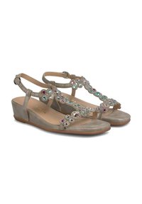Sandalo taupe metallico con tacco a zeppa, dotato di gioielli decorativi con motivi floreali lungo le cinghie e una soletta liscia e opaca.