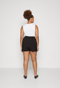 Only Carmakoma Juicy denim shorts
